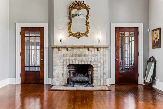 interior space featuring dark hardwood / wood-style floors and a tile fireplace