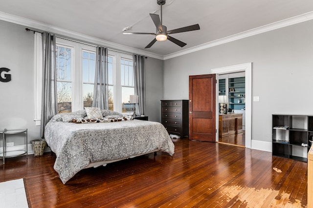 bedroom featuring ceiling fan, ornamental molding, and dark wood-type flooring