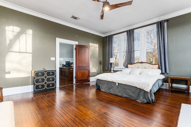 bedroom with ceiling fan, dark wood-type flooring, and crown molding