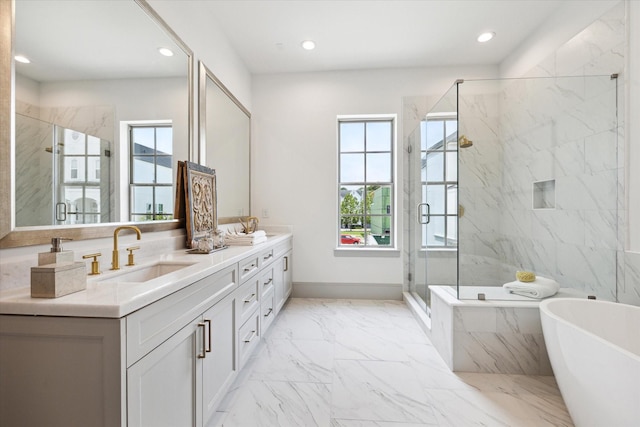 bathroom with plenty of natural light, a freestanding tub, marble look tile flooring, a marble finish shower, and recessed lighting