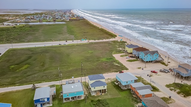 bird's eye view with a water view and a view of the beach