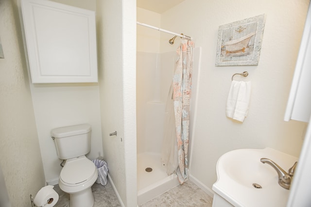 bathroom with sink, curtained shower, tile flooring, and toilet