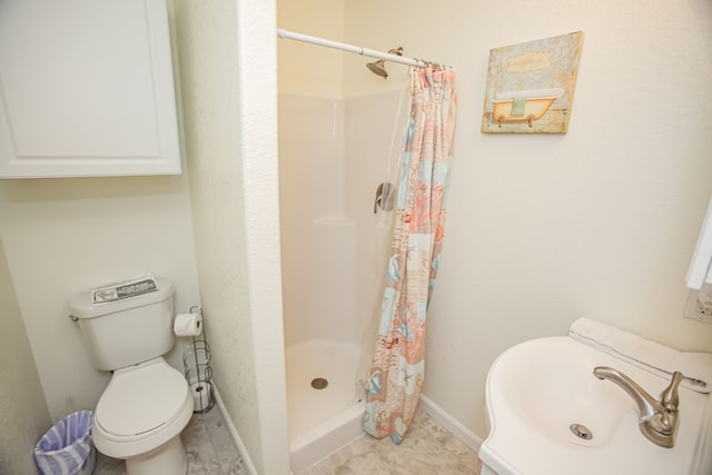 bathroom featuring sink, tile flooring, a shower with shower curtain, and toilet