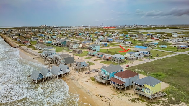 bird's eye view featuring a beach view and a water view