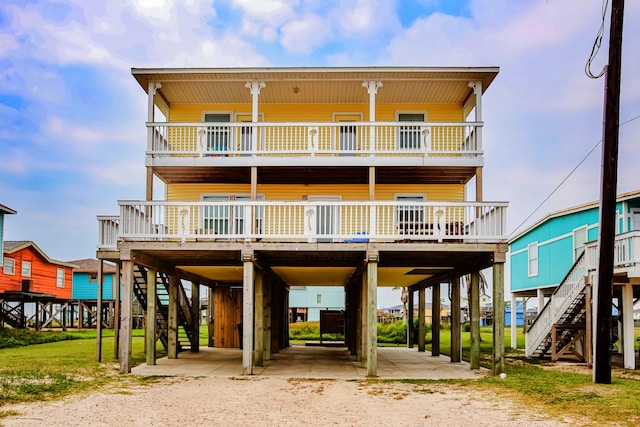 rear view of house with a balcony and a deck