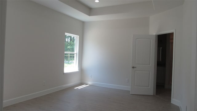 empty room with dark hardwood / wood-style flooring