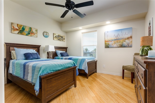 bedroom featuring ceiling fan and light hardwood / wood-style flooring