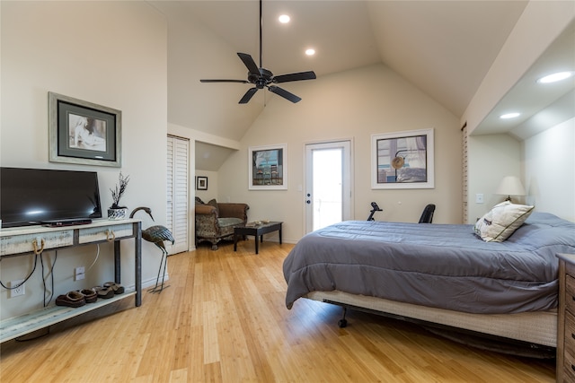 bedroom featuring high vaulted ceiling, light hardwood / wood-style floors, and ceiling fan