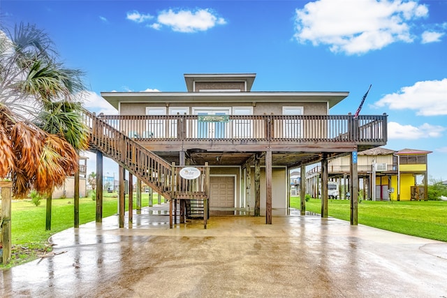 rear view of property featuring a deck and a yard