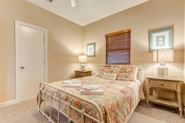 bedroom with light carpet and ceiling fan