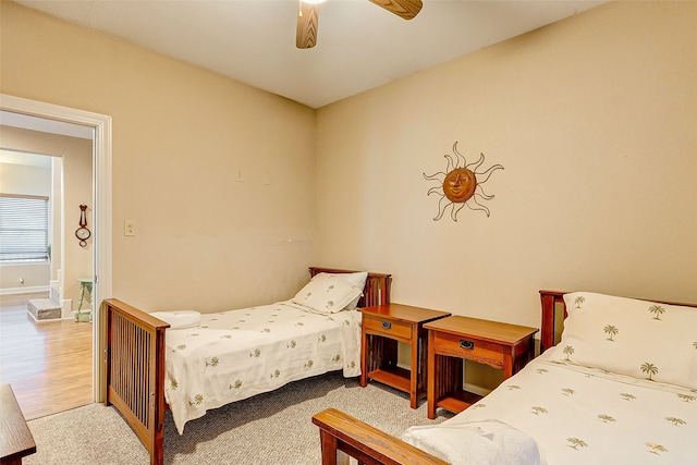 bedroom featuring ceiling fan and light hardwood / wood-style flooring