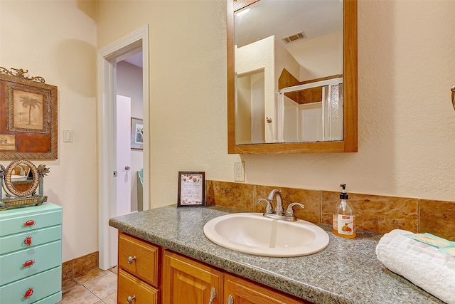 bathroom featuring oversized vanity and tile floors