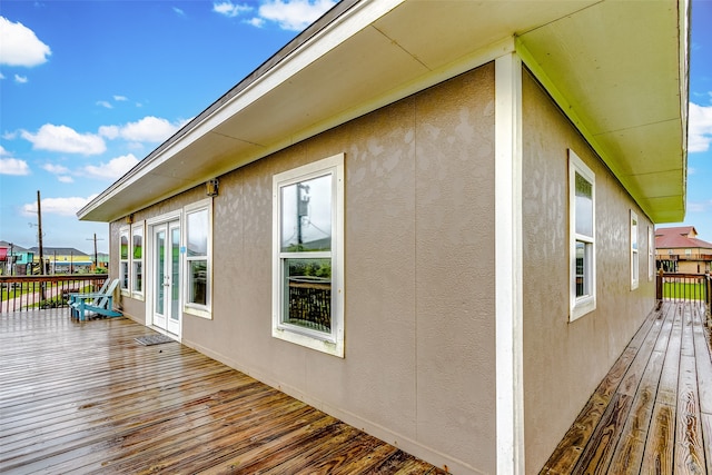 view of side of property with a deck