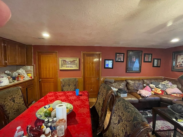 dining area with a textured ceiling