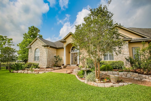 view of front of home with a front lawn