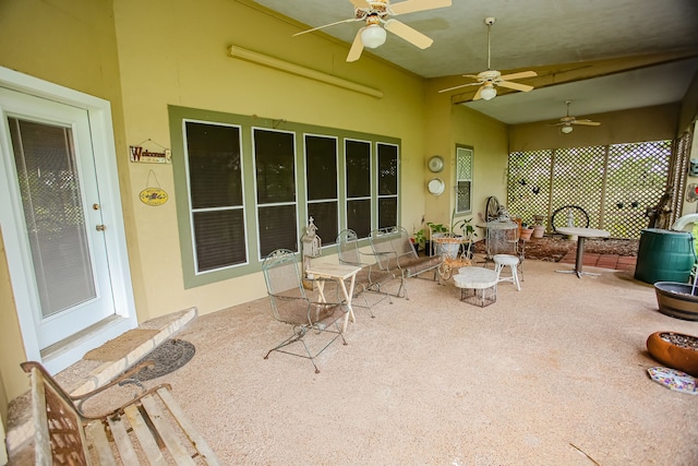 exterior space with ceiling fan