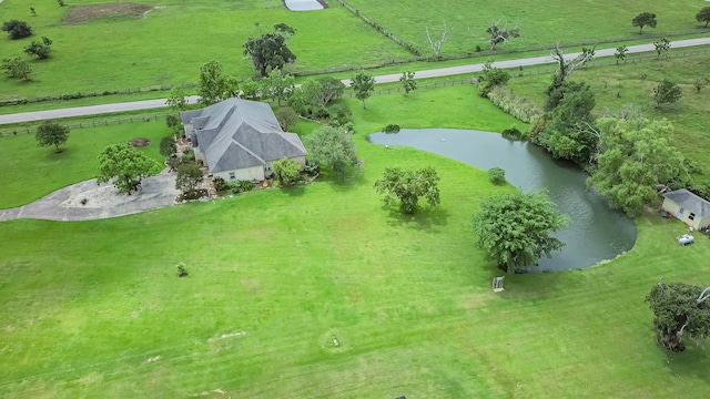 birds eye view of property with a water view and a rural view