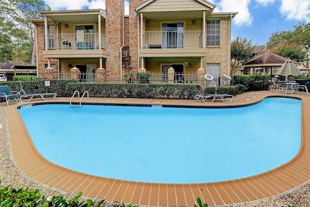 view of swimming pool with a patio