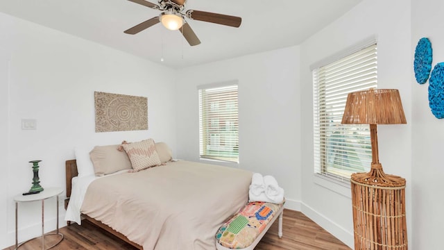 bedroom featuring wood-type flooring and ceiling fan