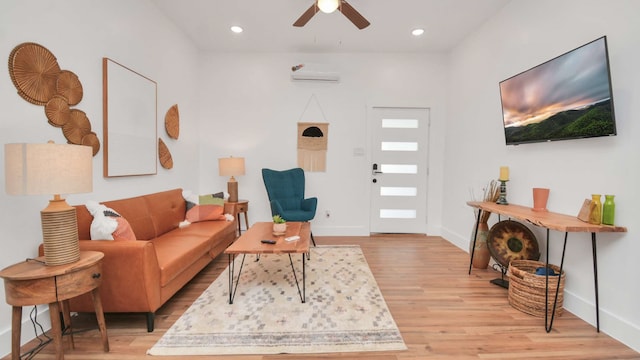 living room featuring light hardwood / wood-style floors and ceiling fan