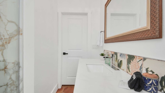 bathroom featuring tile flooring and sink