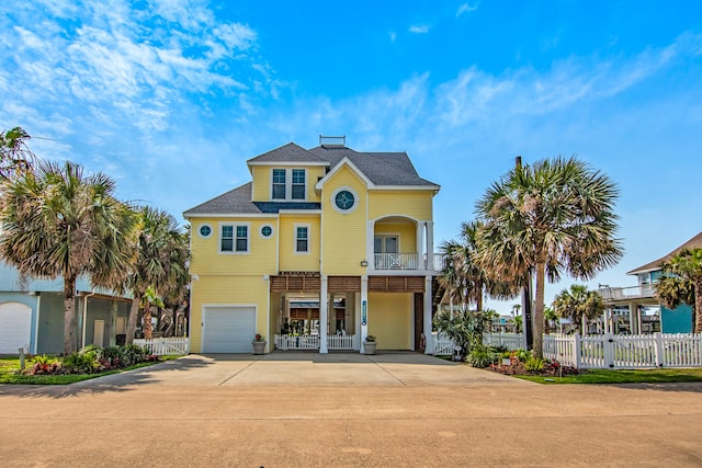 view of front of house with a balcony and a garage