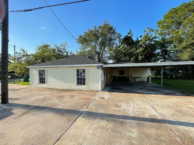 ranch-style house with a carport