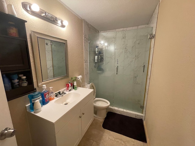 bathroom featuring toilet, a shower with door, tile floors, a textured ceiling, and vanity