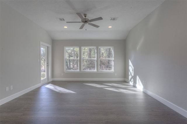 unfurnished room featuring ceiling fan, a textured ceiling, dark wood-type flooring, and vaulted ceiling