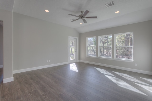 spare room with dark hardwood / wood-style flooring, ceiling fan, and lofted ceiling