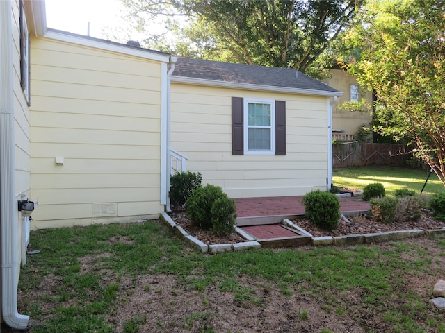 view of outdoor structure featuring a lawn