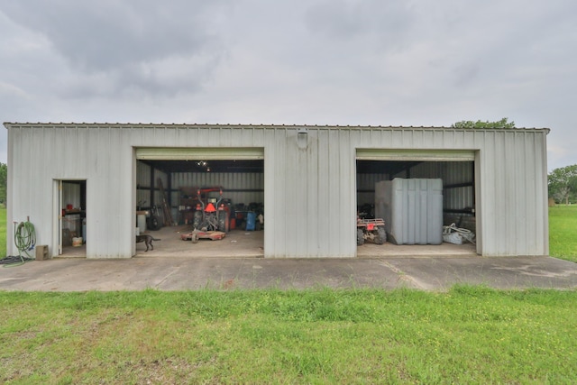 garage with a lawn