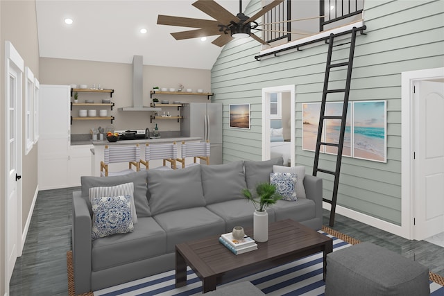 living room featuring lofted ceiling, wood walls, ceiling fan, and dark wood-type flooring