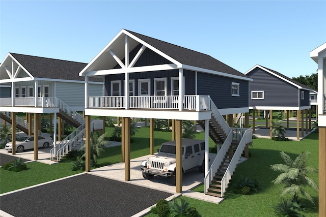 rear view of house with a lawn, a deck, and a sunroom