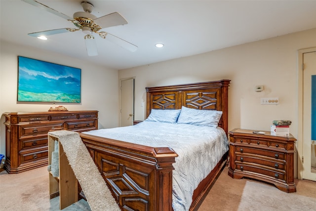 bedroom with light colored carpet and ceiling fan