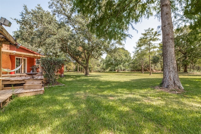 view of yard featuring a deck