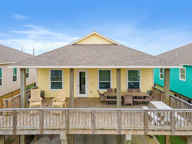 rear view of property featuring a deck