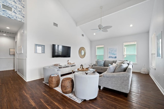 living room with dark wood-type flooring, ceiling fan, and high vaulted ceiling