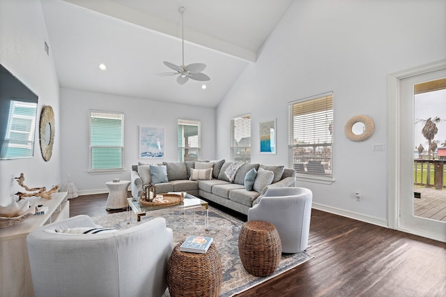 living room with ceiling fan, dark wood-type flooring, and a wealth of natural light