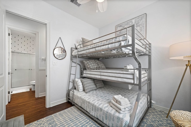 bedroom with dark hardwood / wood-style flooring and ceiling fan