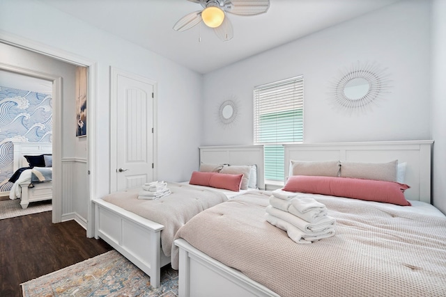 bedroom featuring ceiling fan and dark wood-type flooring