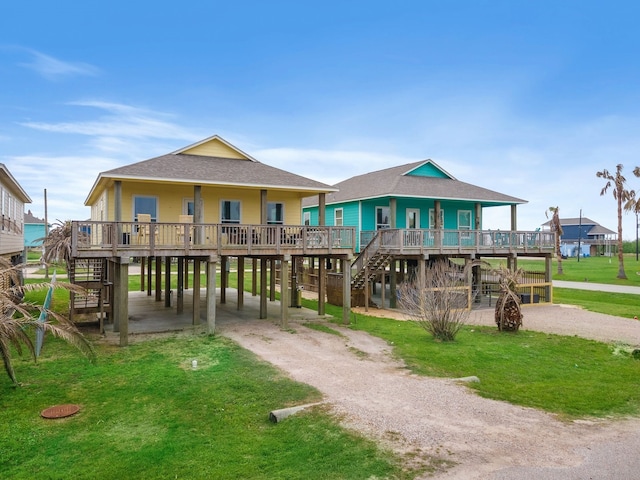 view of front of house featuring a front yard and a wooden deck