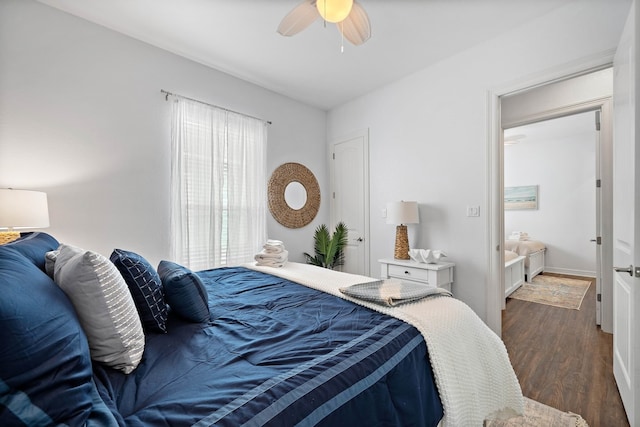 bedroom with ceiling fan and dark hardwood / wood-style floors