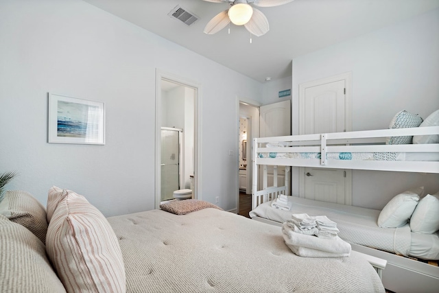 bedroom featuring hardwood / wood-style flooring, ceiling fan, and ensuite bathroom