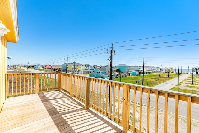 wooden terrace with a yard