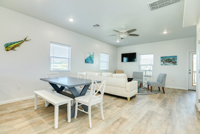 dining room with plenty of natural light, light hardwood / wood-style floors, and ceiling fan