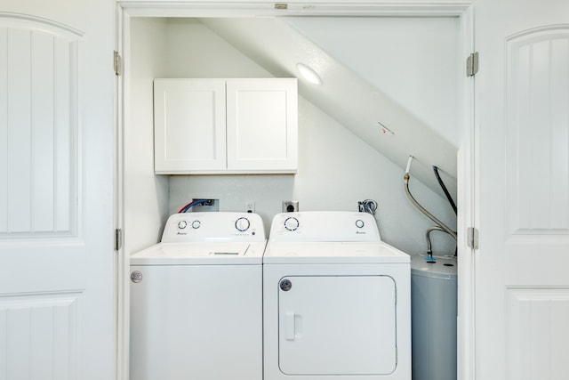 washroom featuring cabinets, washing machine and dryer, and hookup for a washing machine