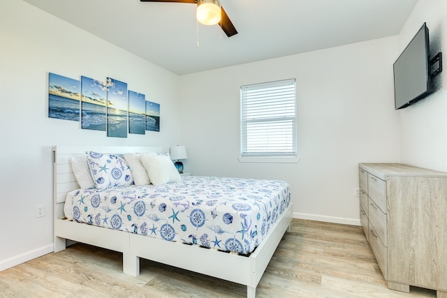 bedroom featuring ceiling fan and light wood-type flooring