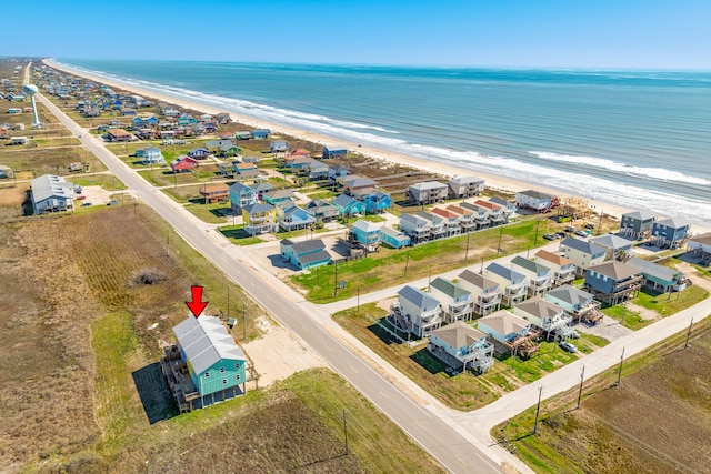 aerial view featuring a water view and a view of the beach