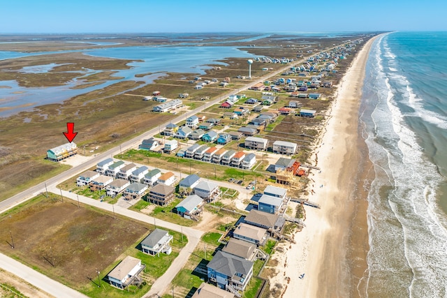 aerial view featuring a view of the beach and a water view